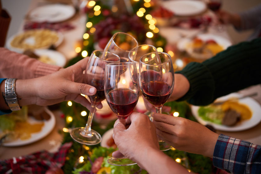 Glasses of red wine toasting Christmas