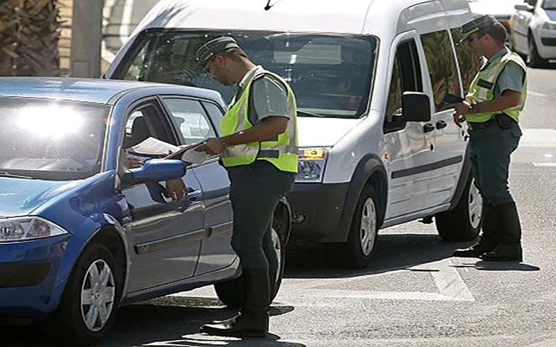 Spanish Guardia Civil officers conducting roadside vehicle check