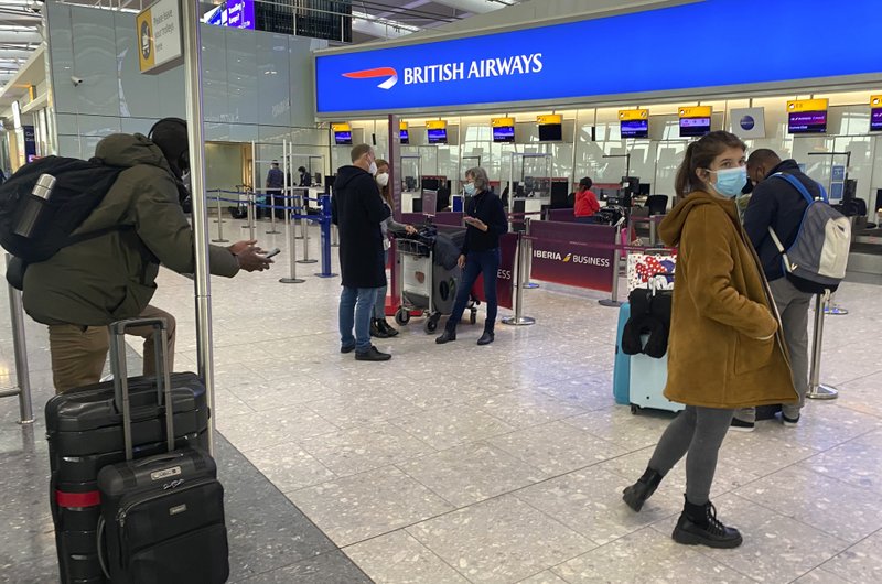 Travellers at British Airways desk