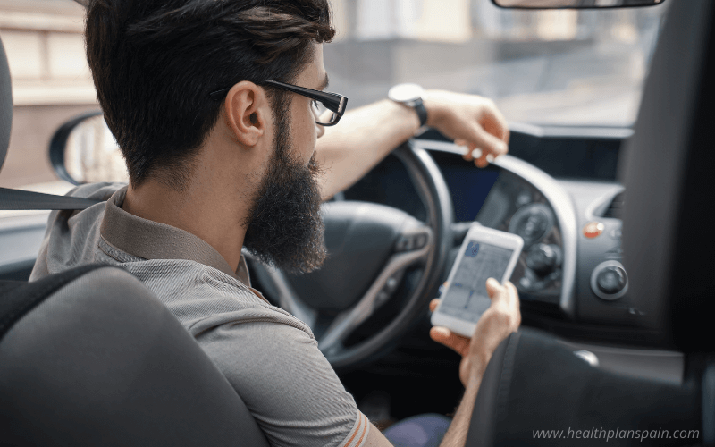 Guy using cellphone while driving