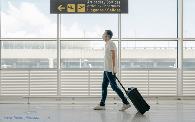 Passenger at airport wearing mask