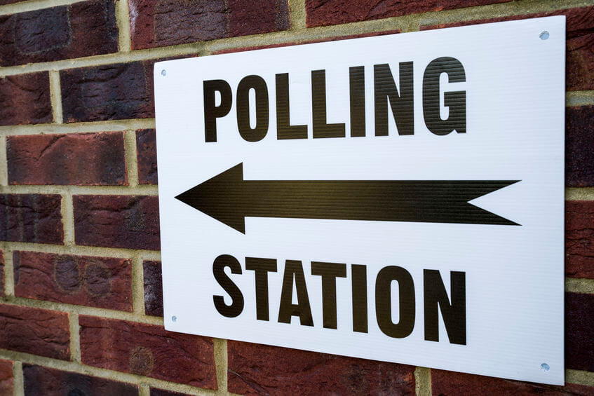 Polling station sign on wall