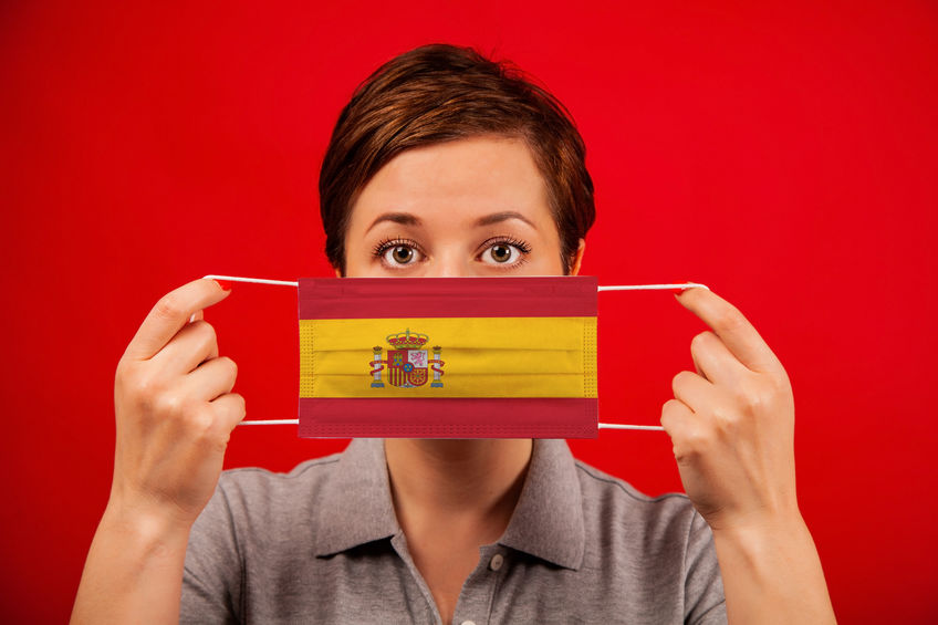 Woman holding Spanish face mask