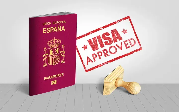 Spanish passport with a visa approved stamp