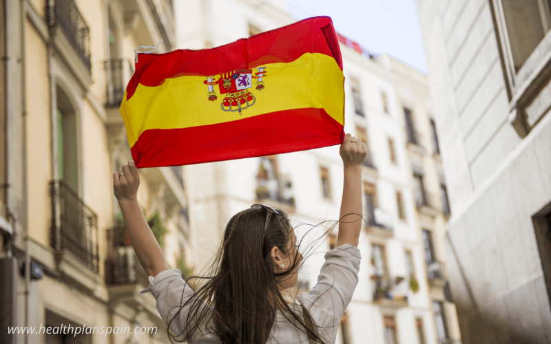 Girl waving Spanish flag